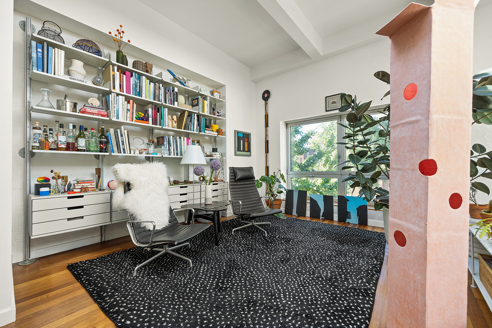 113 2nd Street, Unit 2 Brooklyn, NY 11231 - Photo 2 of 19 a living room with lots of furniture and a book shelf