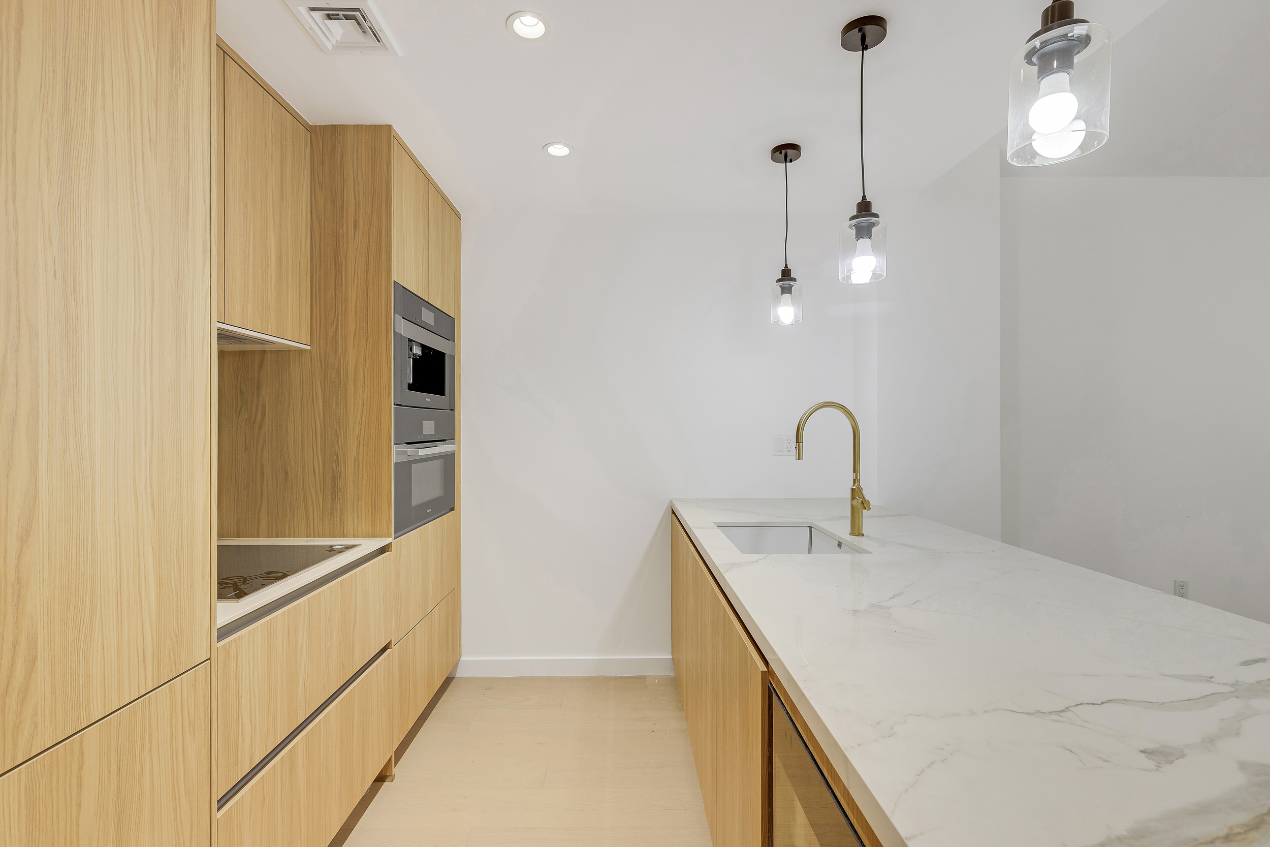 21 West 17th Street, Unit 4 Manhattan, NY 10011 - Photo 4 of 11 a spacious bathroom with a sink and a mirror