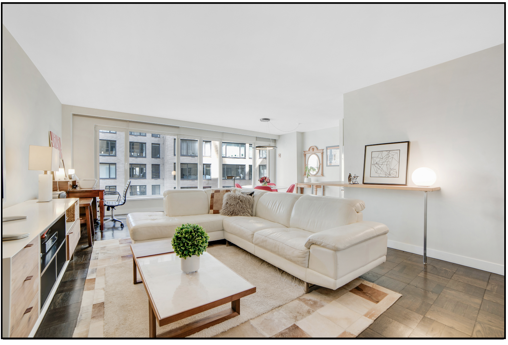 200 Central Park South, Unit 7Q Manhattan, NY 10019 - Photo 1 of 6 a living room with furniture and a fireplace