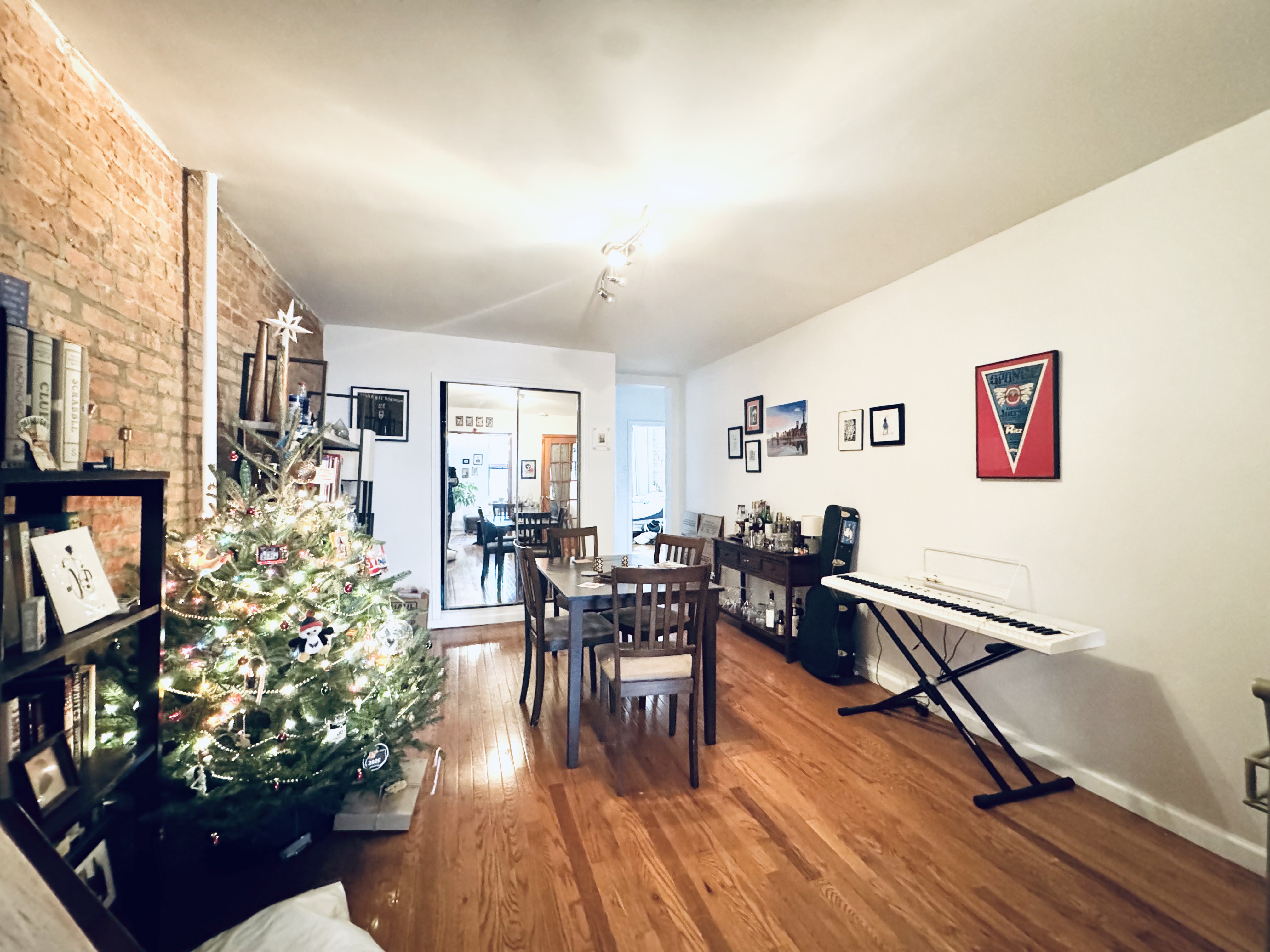 a living room with furniture dining table and a potted plant