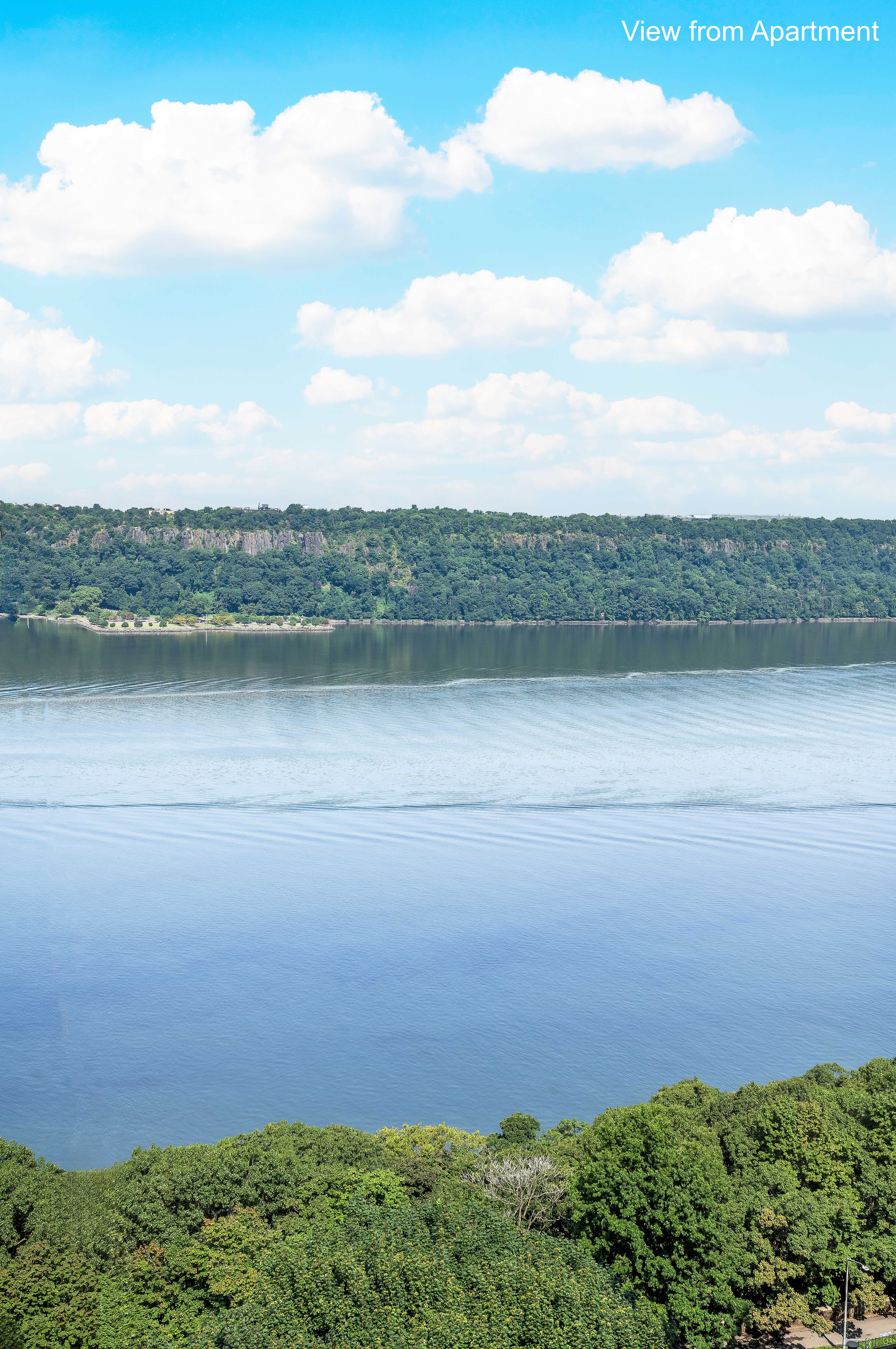 140 Cabrini Boulevard, Unit 136 Manhattan, NY 10033 - Photo 4 of 33 a view of a lake from a yard