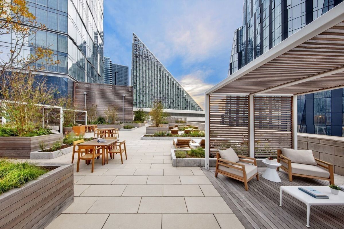 1 West End Avenue, Unit 27D Manhattan, NY 10023 - Photo 13 of 21 a view of a patio with couches and dining table with garden view