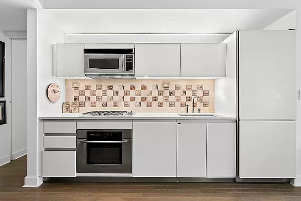 425 East 13th Street, Unit 2A Manhattan, NY 10009 - Photo 5 of 7 a bathroom with a sink and a mirror
