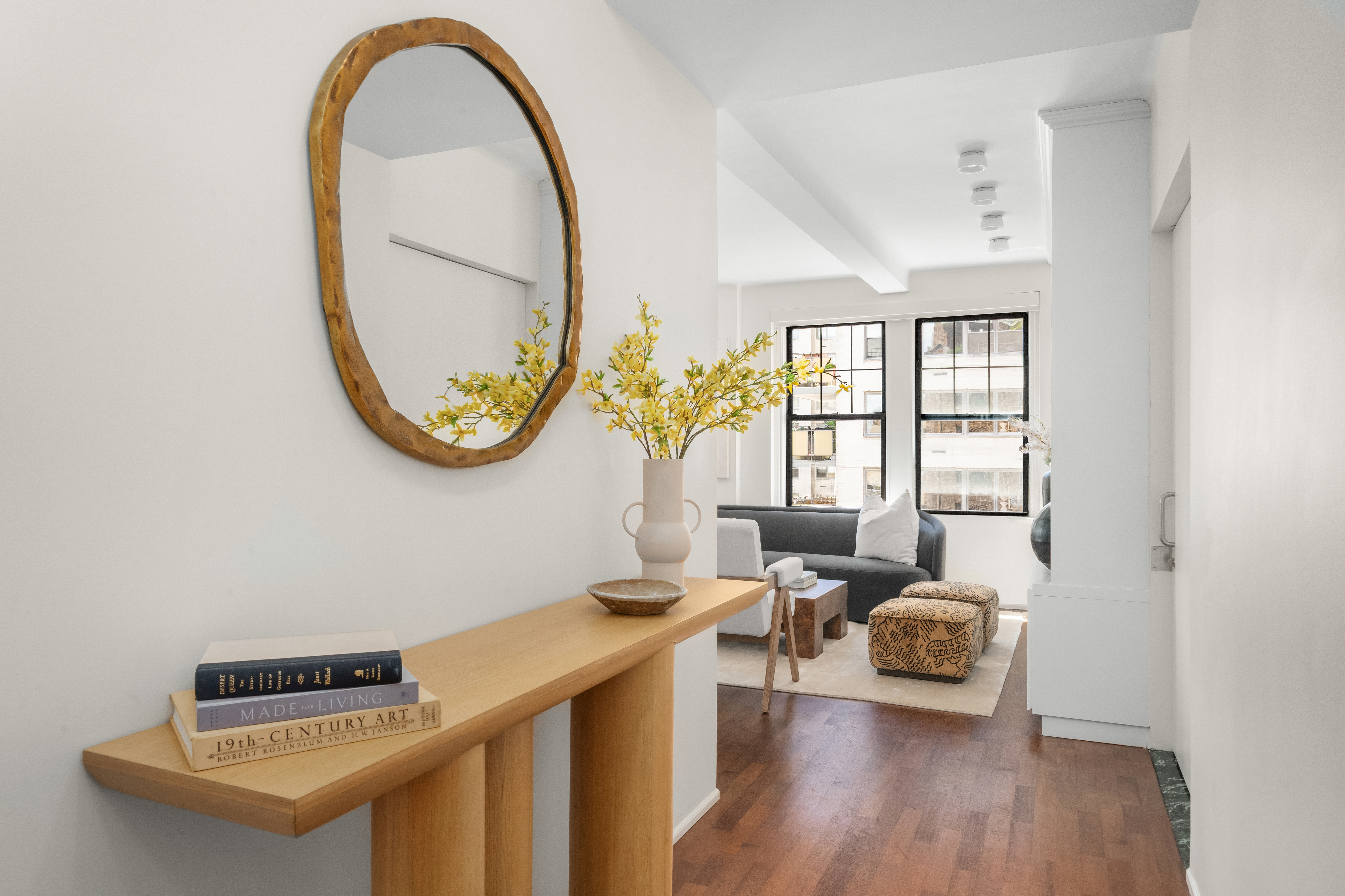 23 West 73rd Street, Unit 1001 Manhattan, NY 10023 - Photo 13 of 14 a living room with furniture and a window