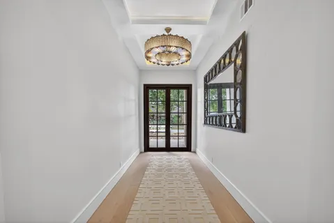 a view of a hallway with a window