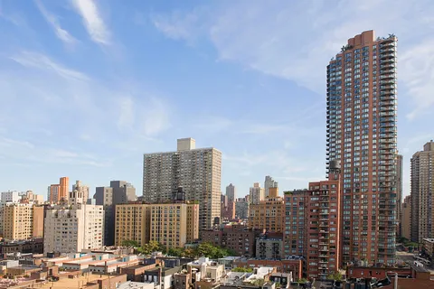 a view of a city with tall buildings