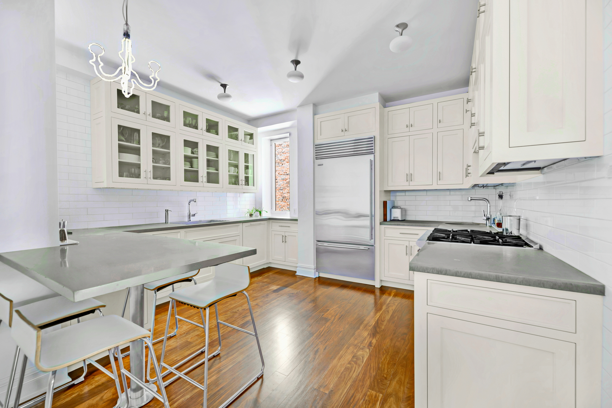 254 West 82nd Street, Unit 5A Manhattan, NY 10024 - Photo 5 of 18 a kitchen with stainless steel appliances granite countertop a stove and a refrigerator