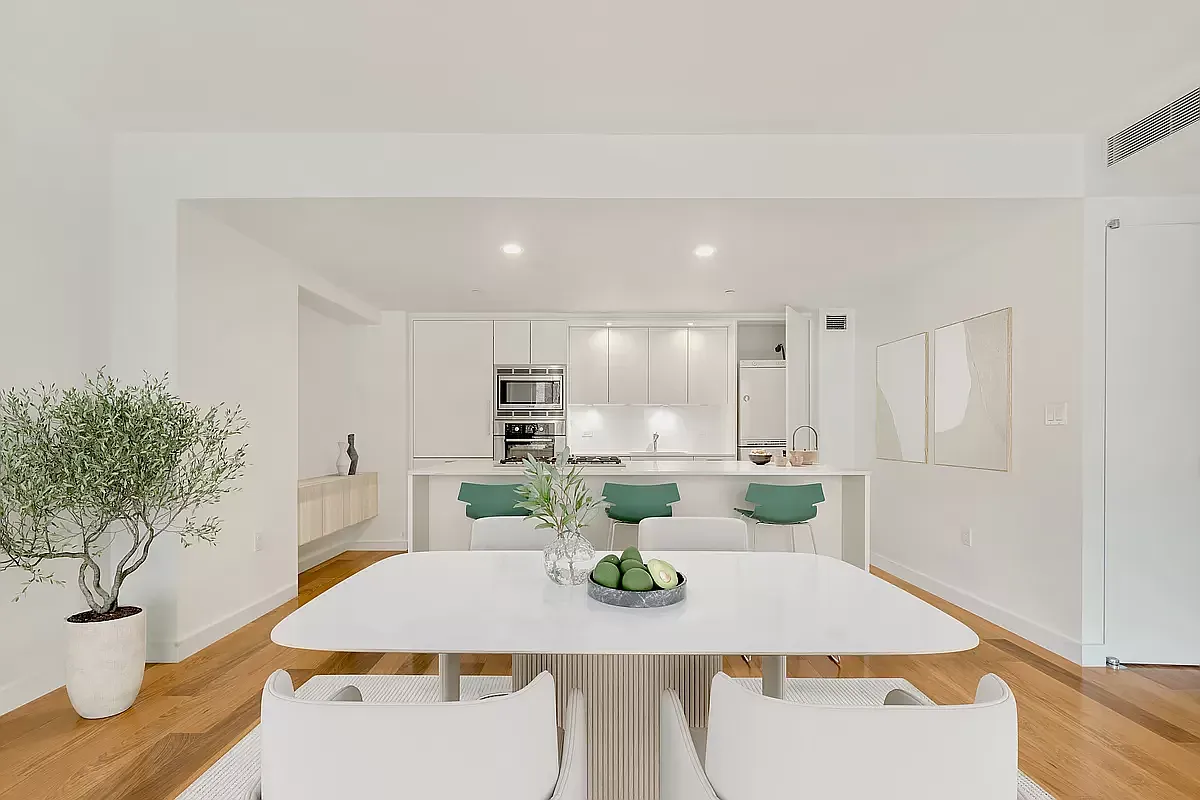 a kitchen with a table and chairs