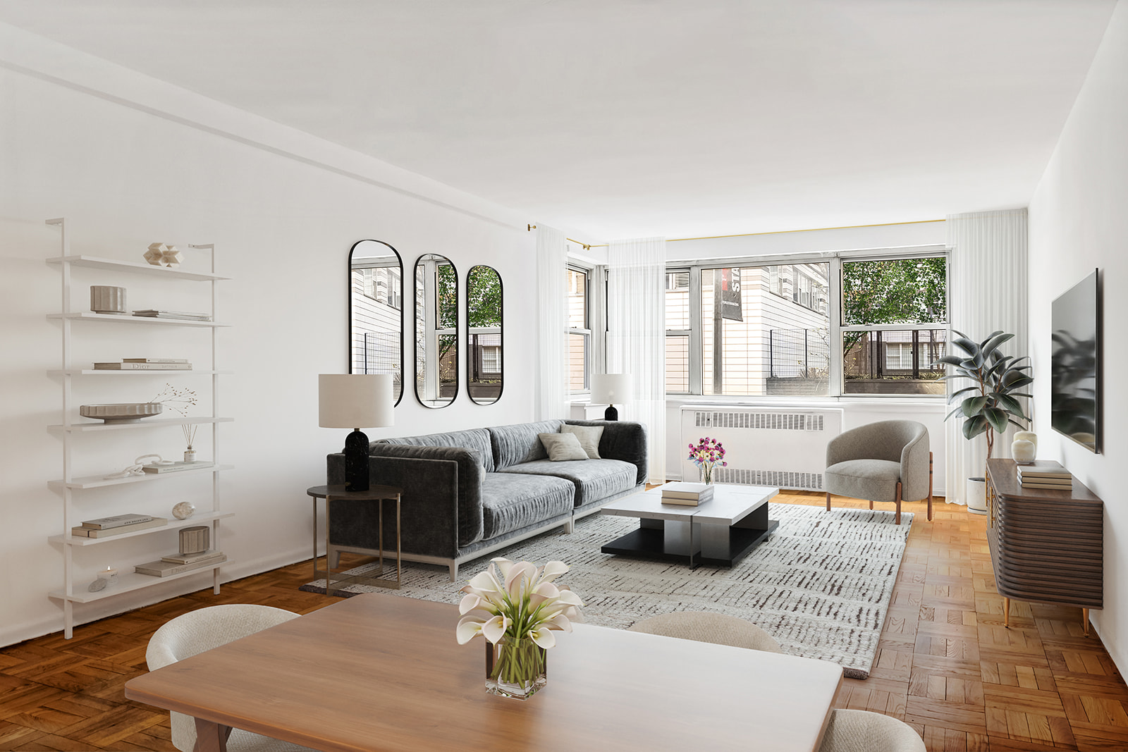 a living room with furniture a large window and wooden floor