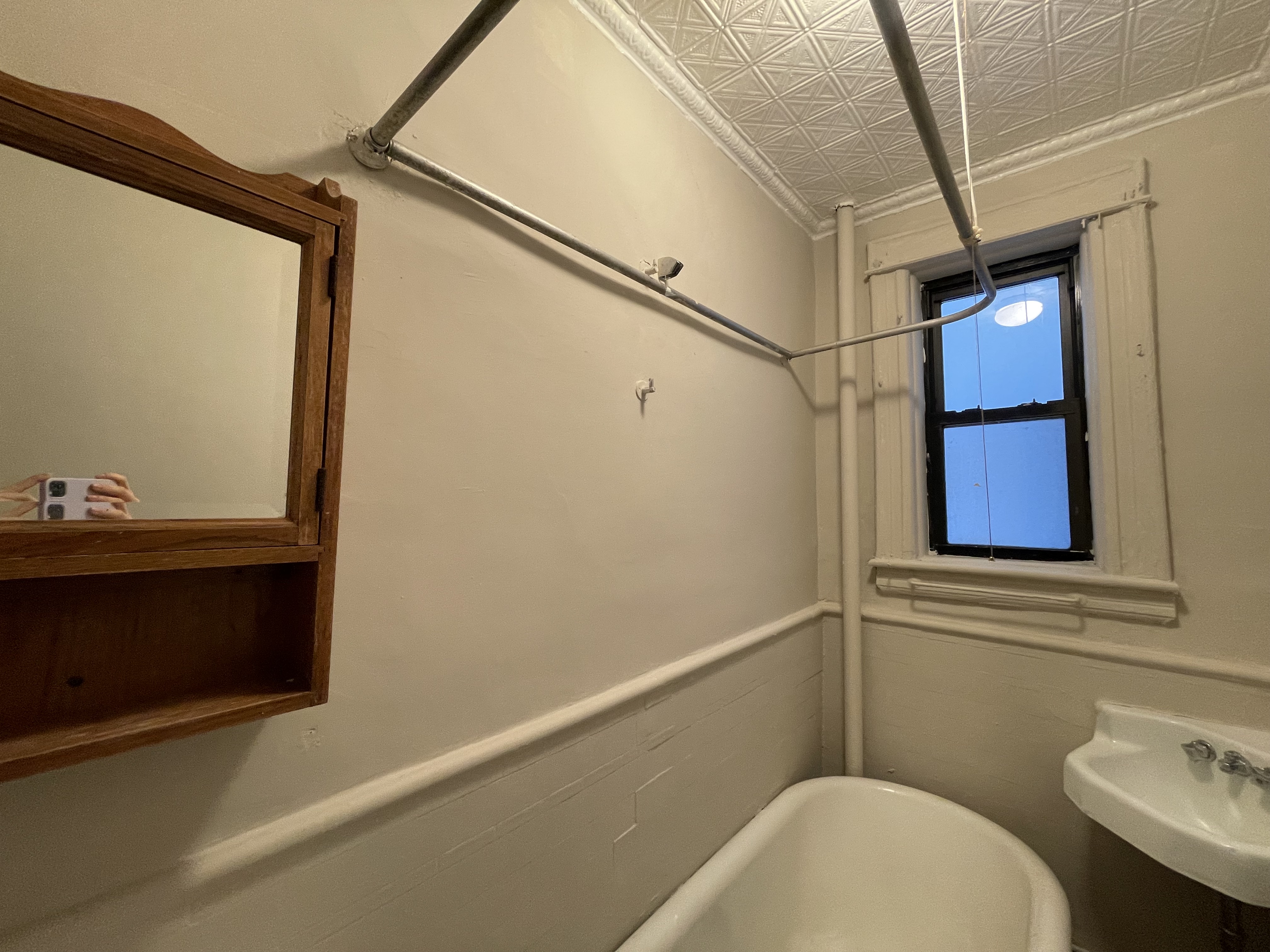 68-43 Fresh Pond Road, Unit 4R Queens, NY 11385 - Photo 4 of 5 a bathroom with a toilet and a sink