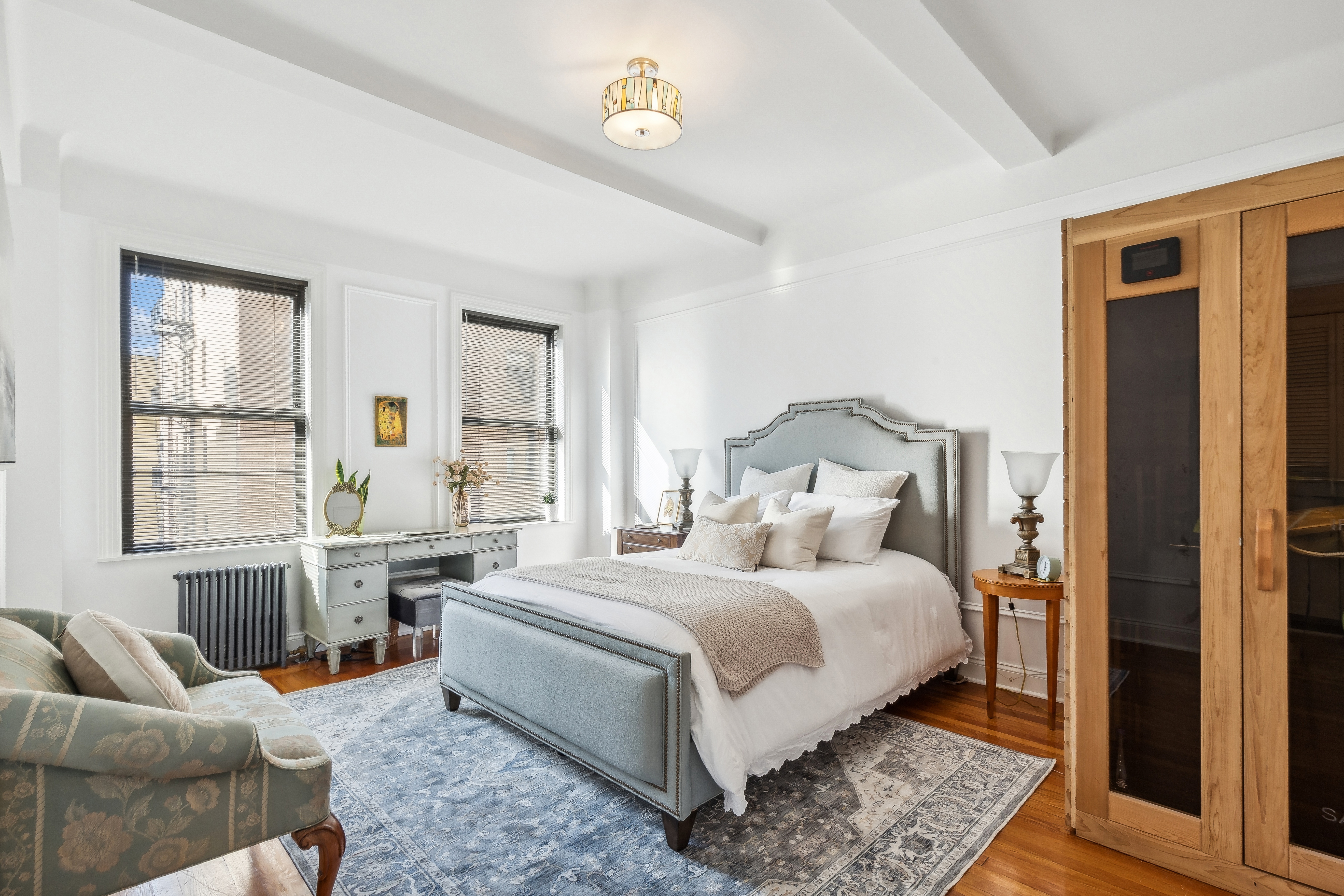 300 Riverside Drive, Unit 5E Manhattan, NY 10025 - Photo 8 of 11 a bedroom with a bed and wooden floor