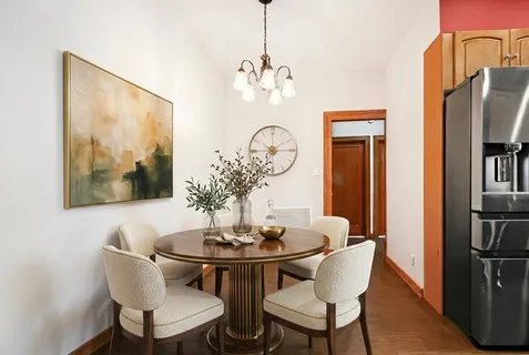 a dining room with furniture and chandelier