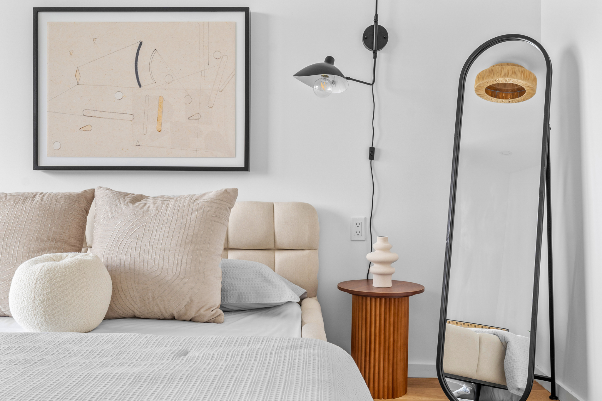 14-35 Broadway, Unit 2B Queens, NY 11106 - Photo 7 of 8 a bedroom with a bed and painting on the wall