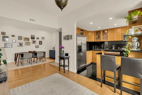a kitchen with stainless steel appliances granite countertop a sink and cabinets