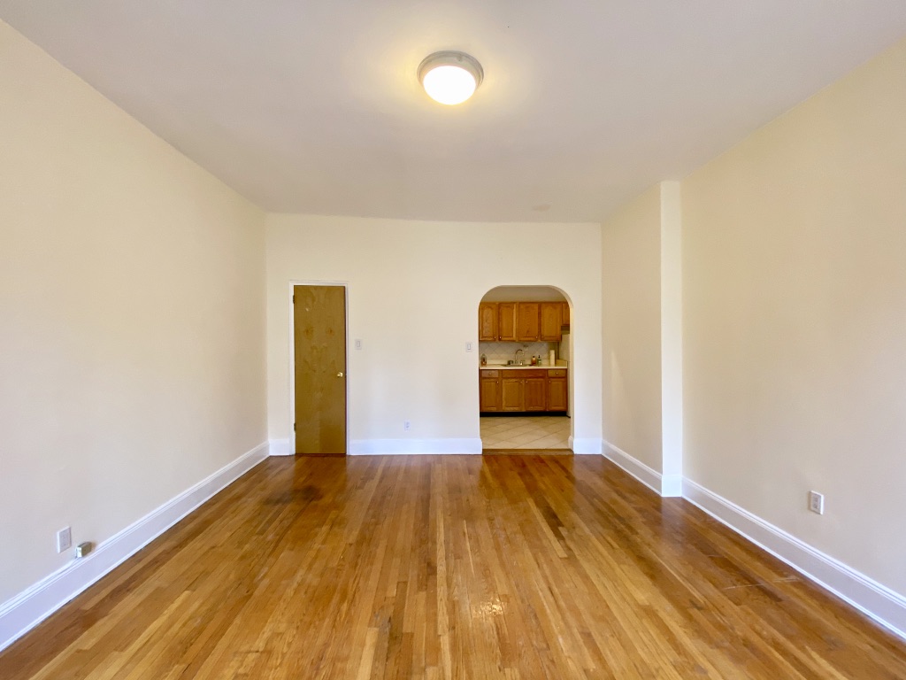 619 9th Avenue, Unit 3E Manhattan, NY 10036 - Photo 4 of 22 a view of a room with wooden floor