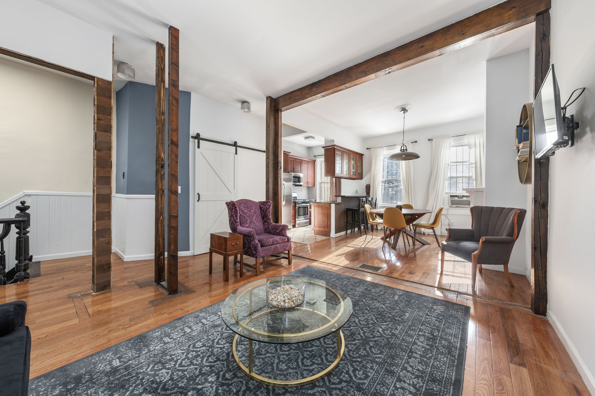 1218 Saint Marks Avenue Brooklyn, NY 11213 - Photo 2 of 42 a living room with furniture a rug and a large window
