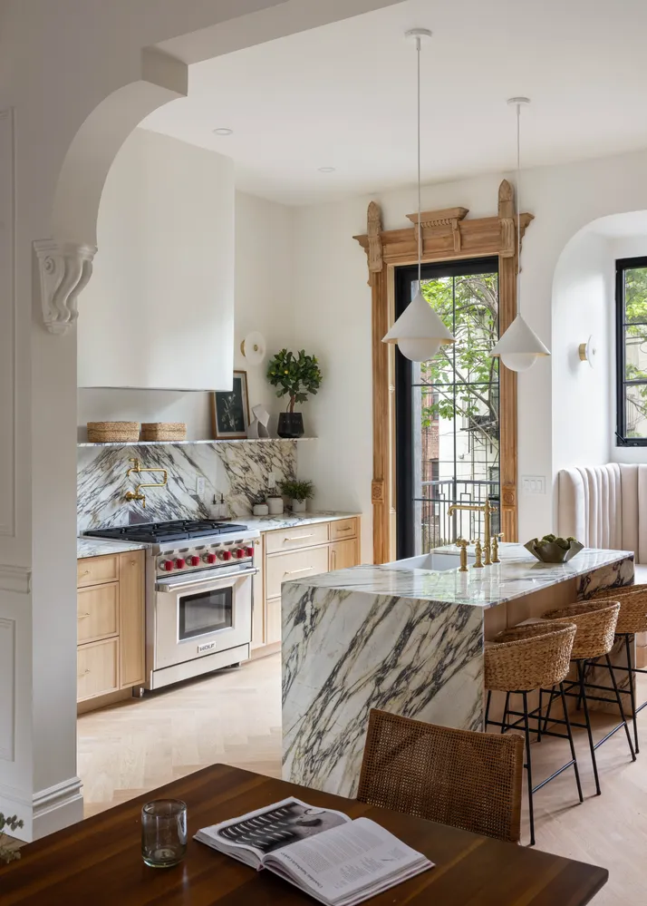 a kitchen with stainless steel appliances granite countertop a stove and a refrigerator