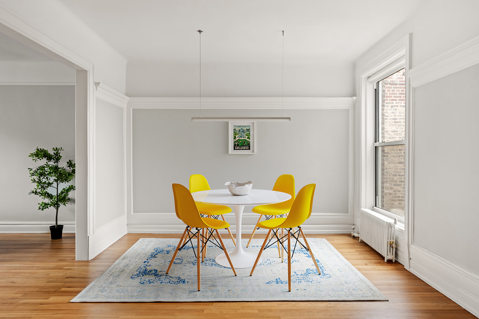 34-43 82nd Street, Unit 51 Queens, NY 11372 - Photo 2 of 12 a view of a dining room with furniture and a potted plant