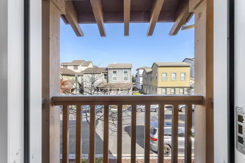 a white toilet sitting next to a shower curtain