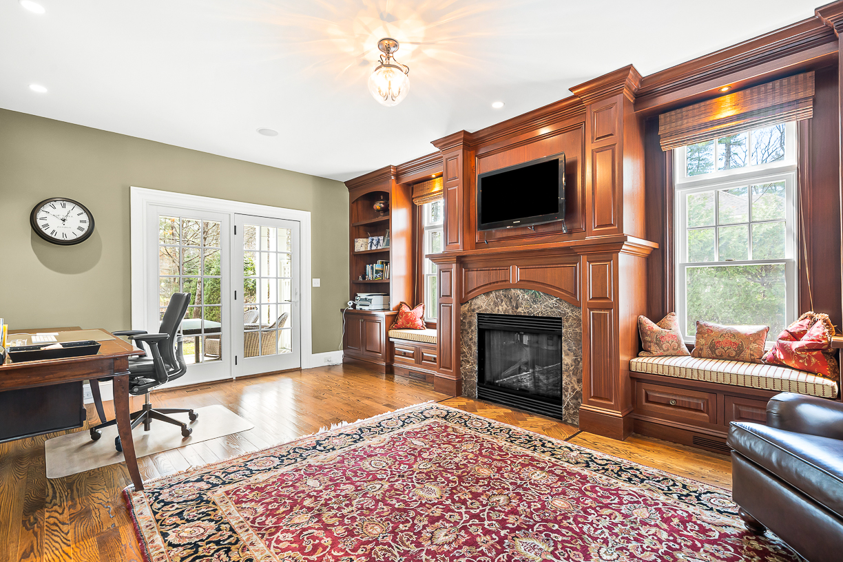 Country Way Needham, MA 02492 - Photo 13 of 27 a living room with furniture a flat screen tv and a fireplace
