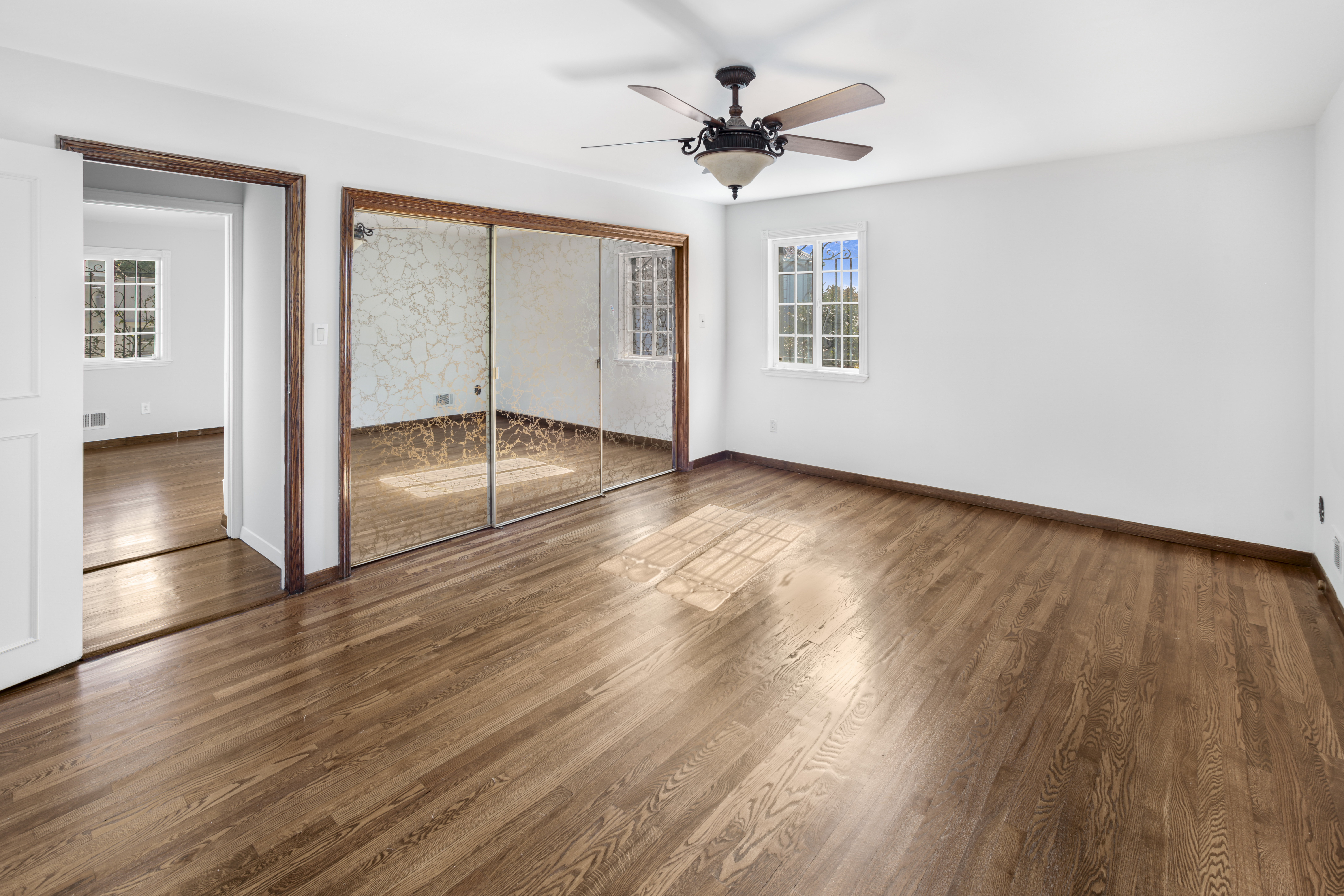 60 82nd Street Brooklyn, NY 11209 - Photo 12 of 19 a view of empty room with wooden floor and fan