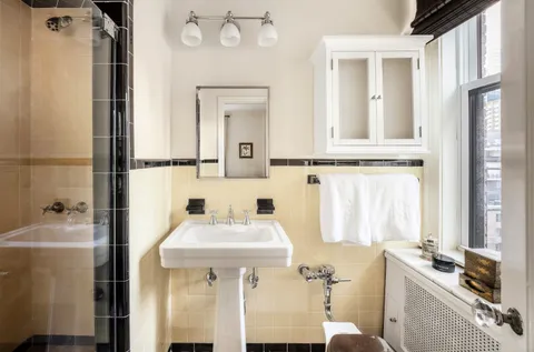 a bathroom with a sink toilet and tub