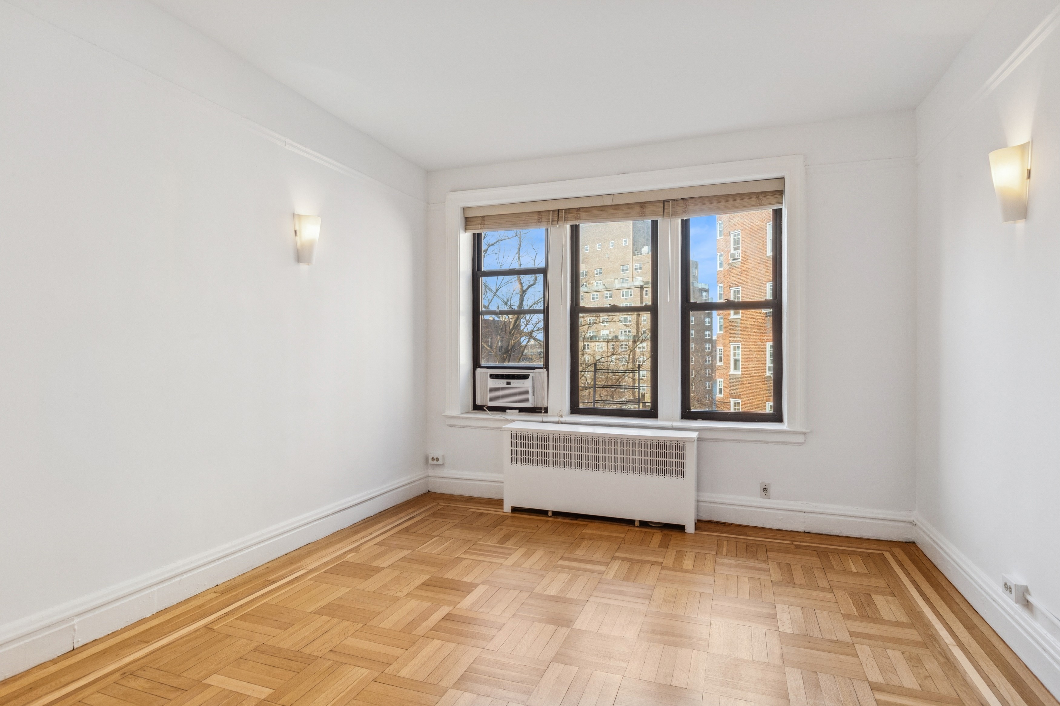 115 Cabrini Boulevard, Unit B51 Manhattan, NY 10033 - Photo 12 of 23 an empty room with windows