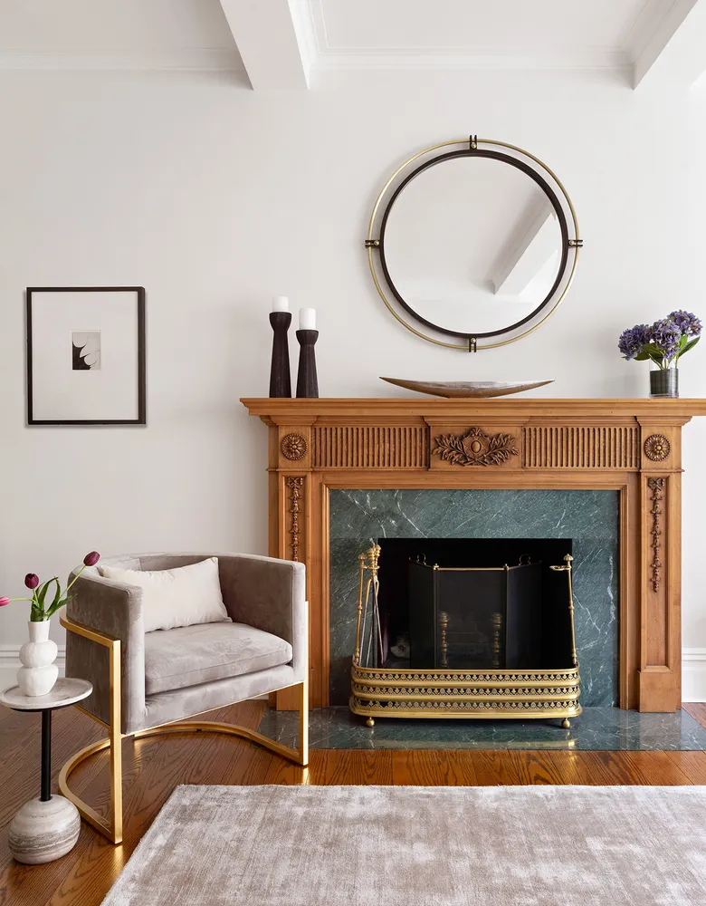 a living room with furniture a fireplace and a table