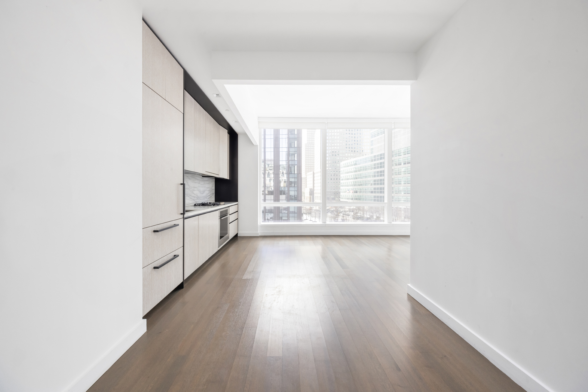111 Murray Street, Unit 7D Manhattan, NY 10007 - Photo 12 of 17 wooden floor in an empty room with a window