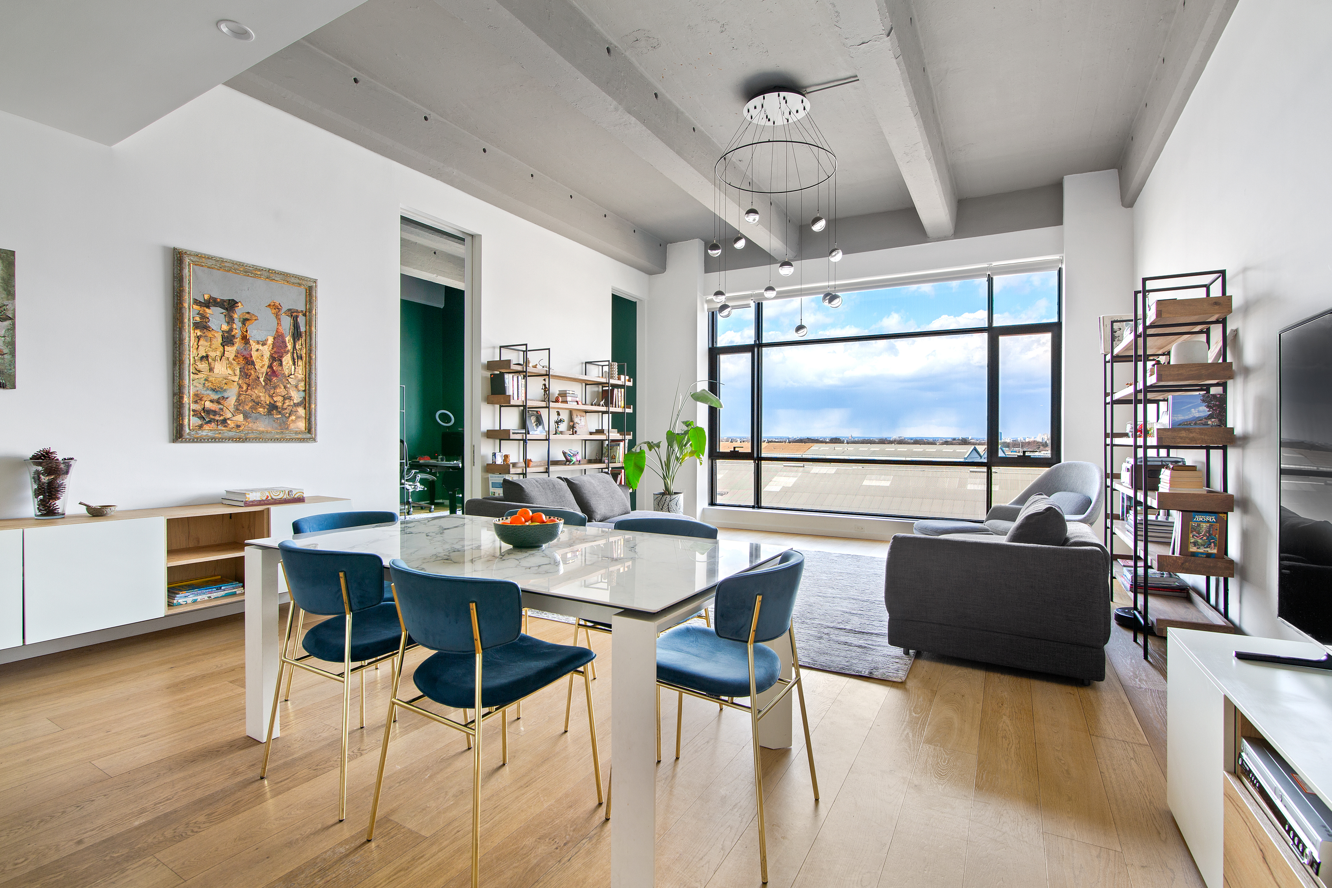 a view of a dining room with furniture window and wooden floor