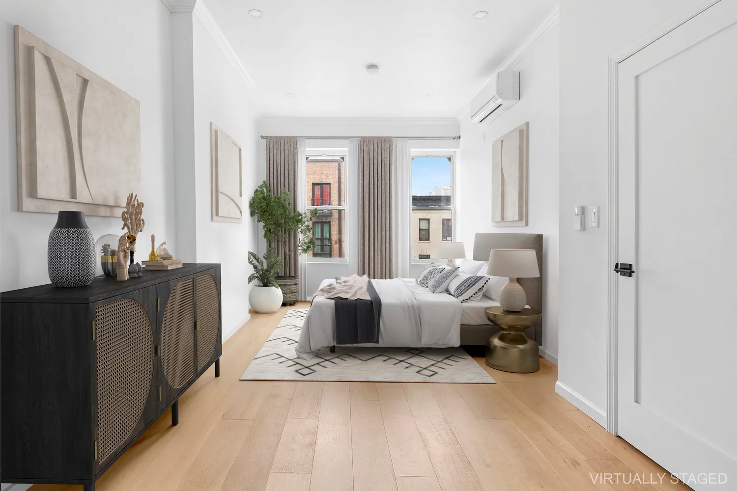 a living room with furniture and large windows