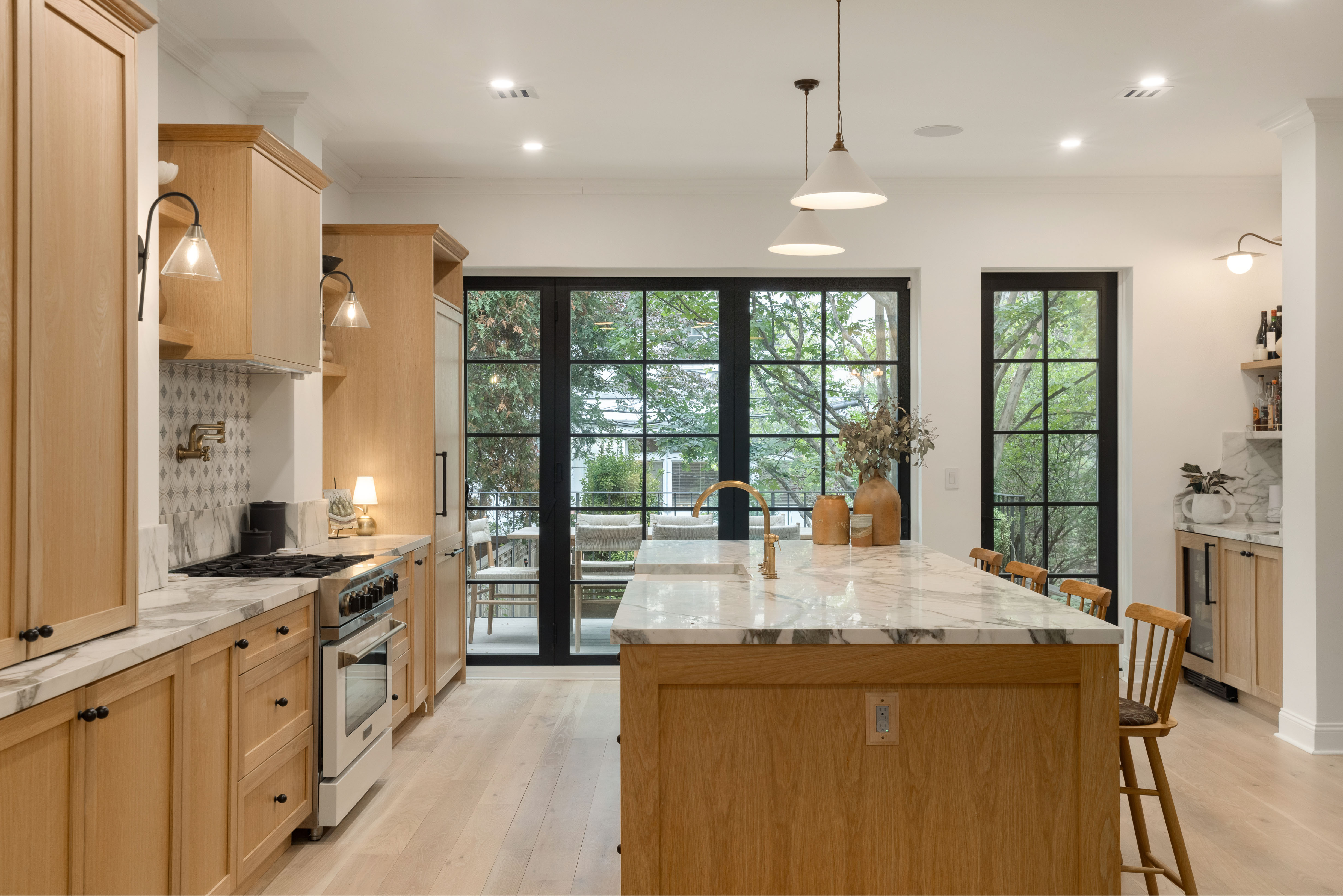309 Pacific Street Brooklyn, NY 11201 - Photo 3 of 22 a large kitchen with kitchen island a large window a sink and stainless steel appliances