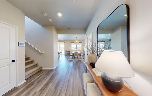 a view of a living room and wooden floor