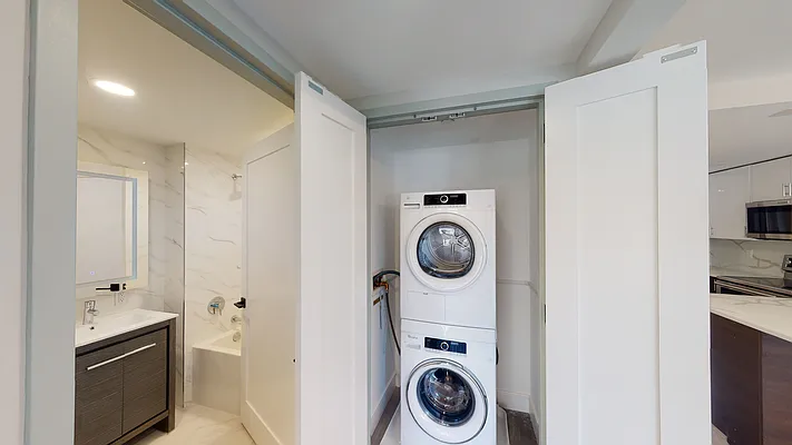605 Hart Street, Unit 606 Brooklyn, NY 11221 - Photo 5 of 10 a bathroom with a sink and a washer dryer