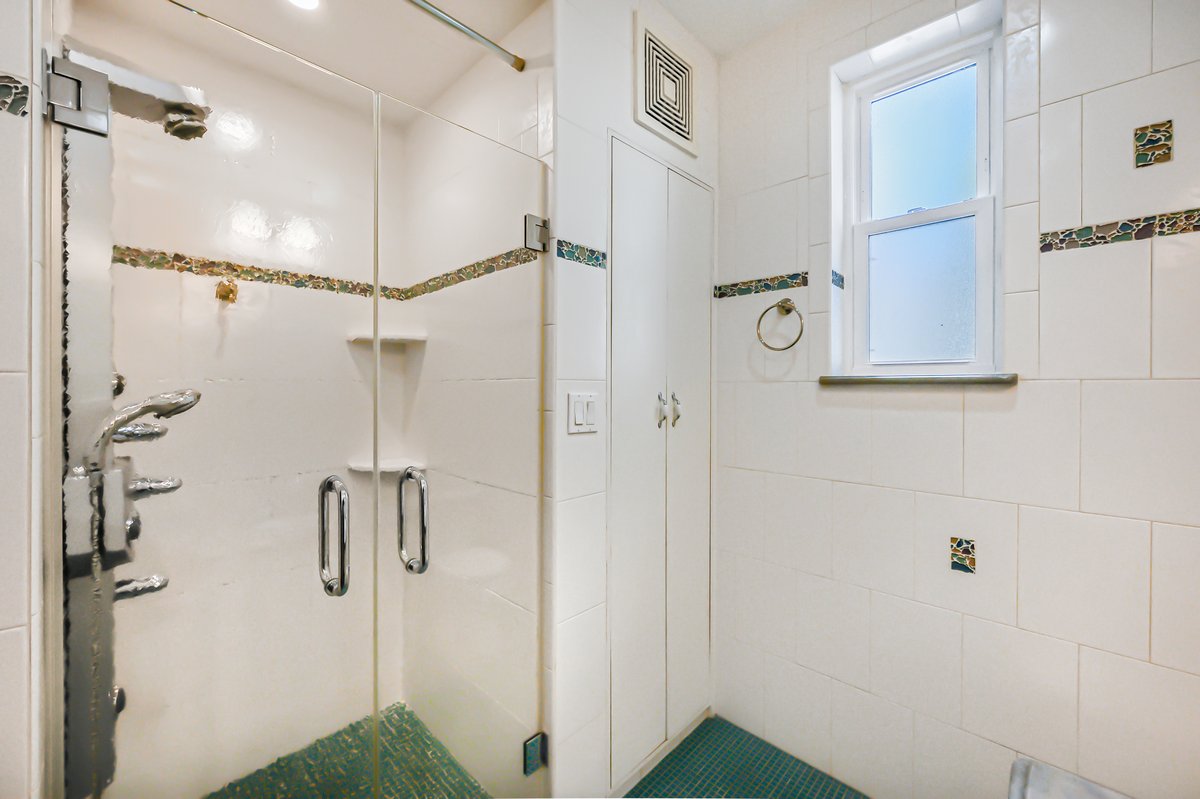 1702 11th Avenue Brooklyn, NY 11218 - Photo 18 of 25 a bathroom with a shower