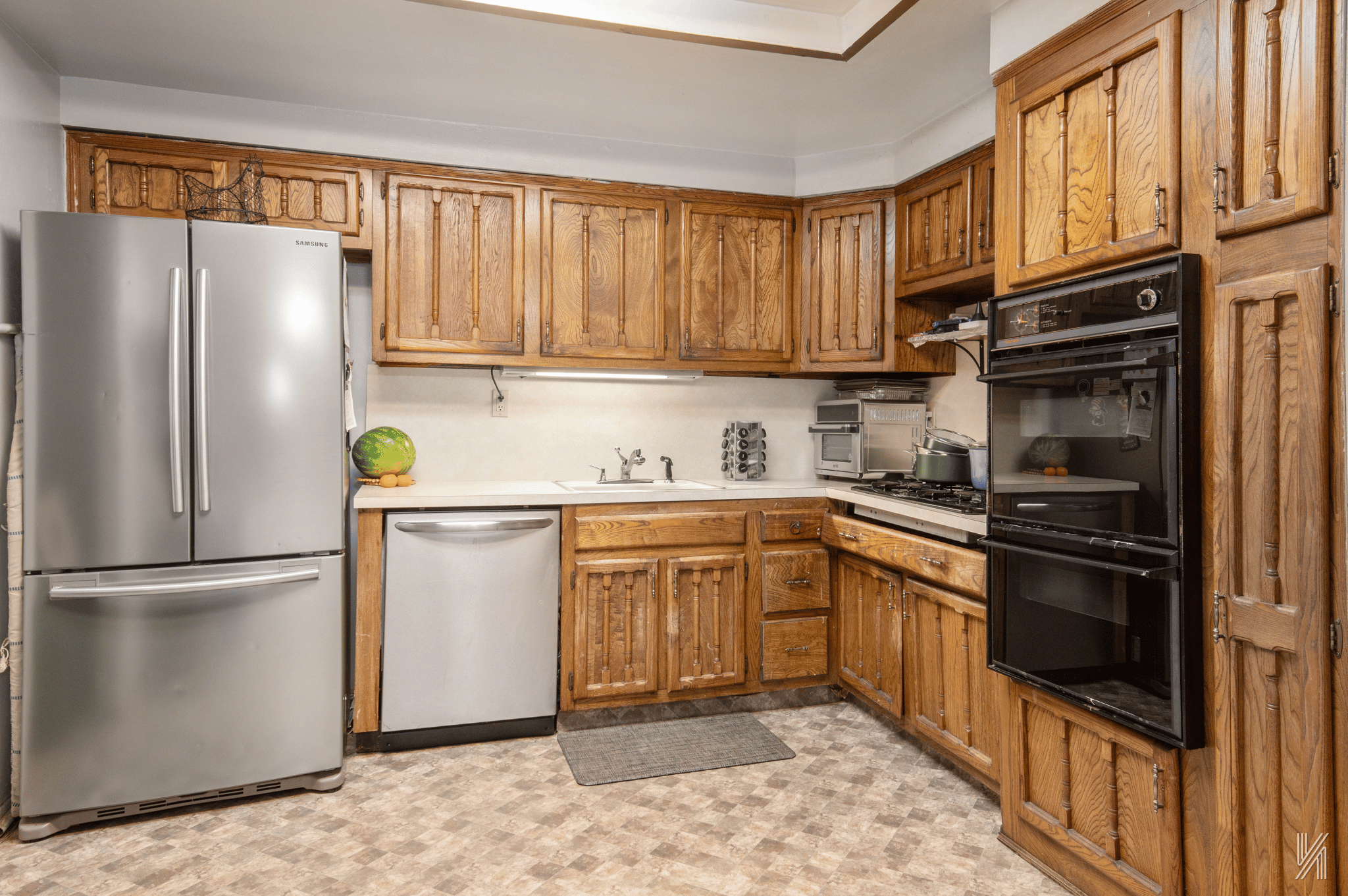 1148 East 73rd Street Brooklyn, NY 11234 - Photo 4 of 15 a kitchen with stainless steel appliances granite countertop a refrigerator sink and stove