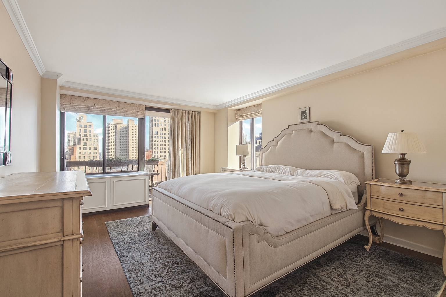 1441 3rd Avenue, Unit 14AB Manhattan, NY 10028 - Photo 4 of 16 a spacious bedroom with a bed and a large window