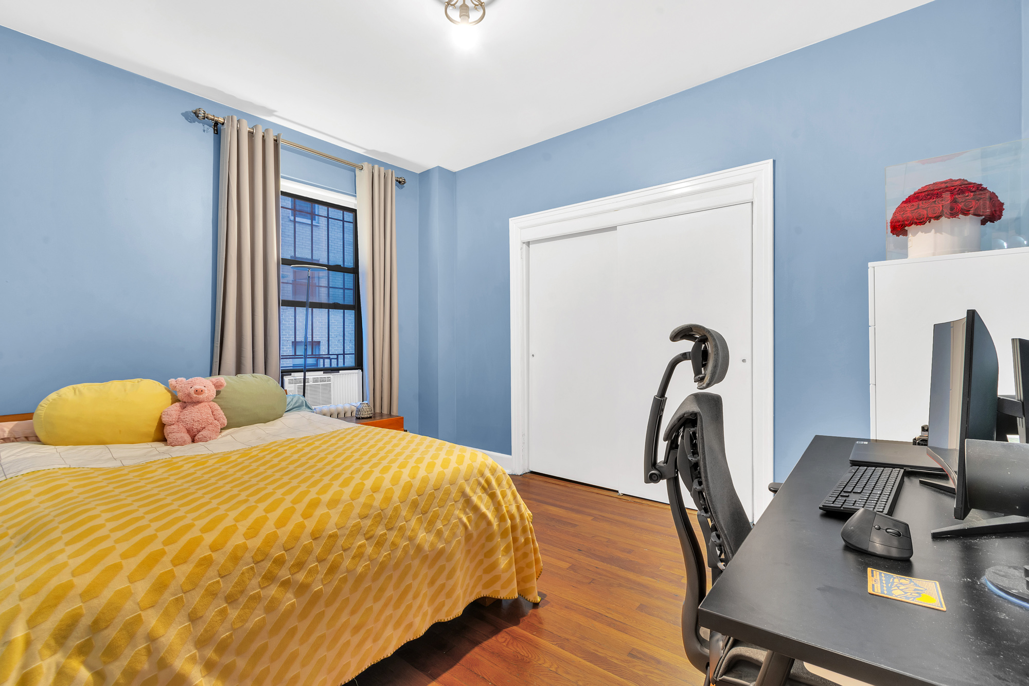 26 West 97th Street, Unit 2C Manhattan, NY 10025 - Photo 8 of 9 a bedroom with a bed and a desk