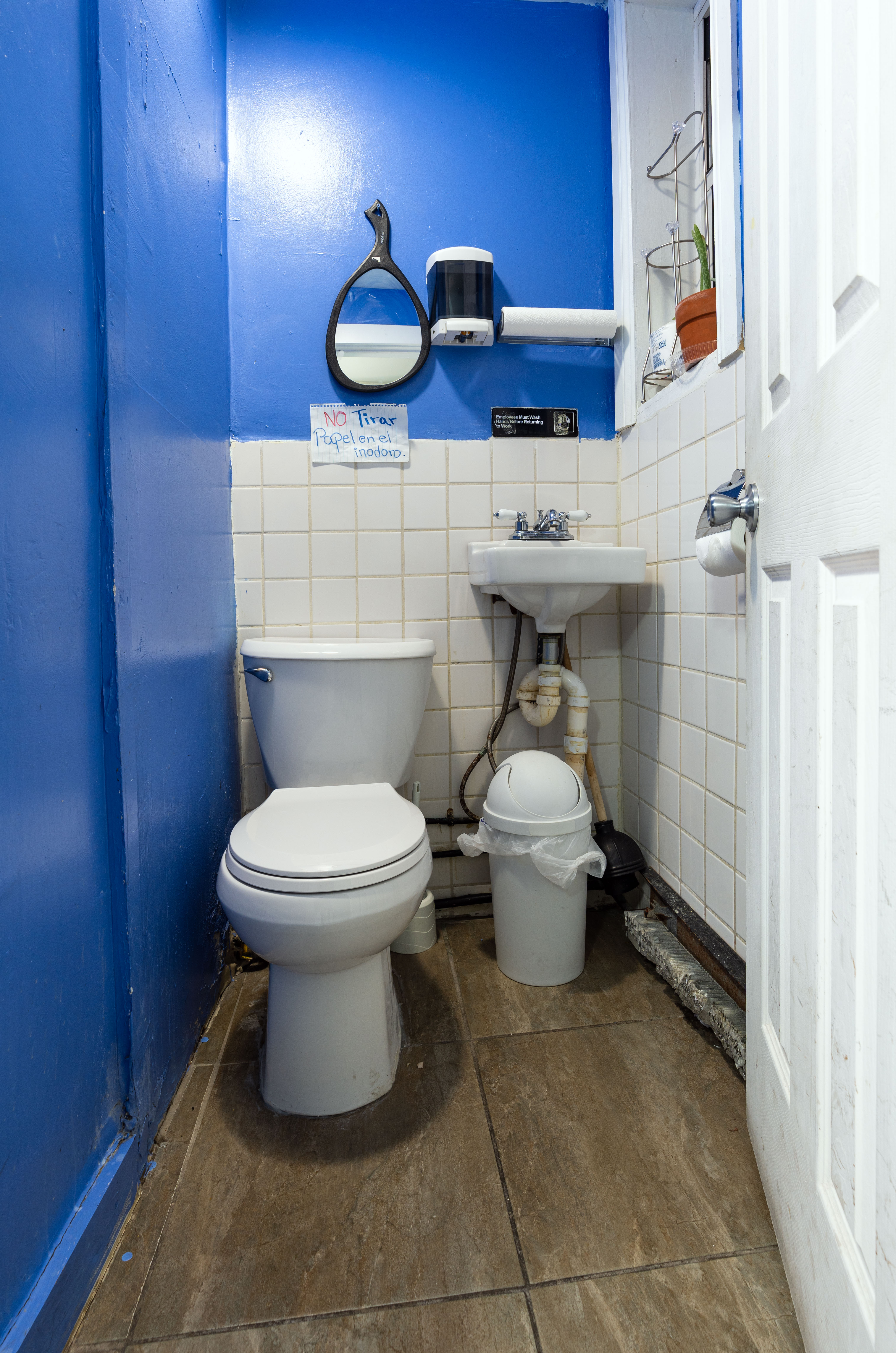 936 Seneca Avenue Queens, NY 11385 - Photo 4 of 12 a bathroom with a toilet sink and mirror