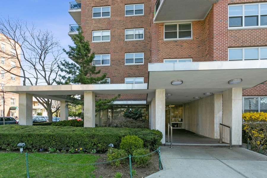 70-31 108th Street, Unit 12D Queens, NY 11375 - Photo 12 of 16 a view of a house with a yard and plants