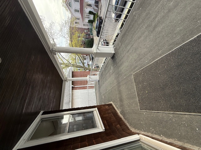 1587 East 18th Street, Unit 2 Brooklyn, NY 11230 - Photo 13 of 13 a view of a car park from a ceiling window