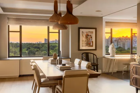 a dining room with furniture and window