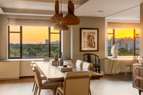 a dining room with furniture and window