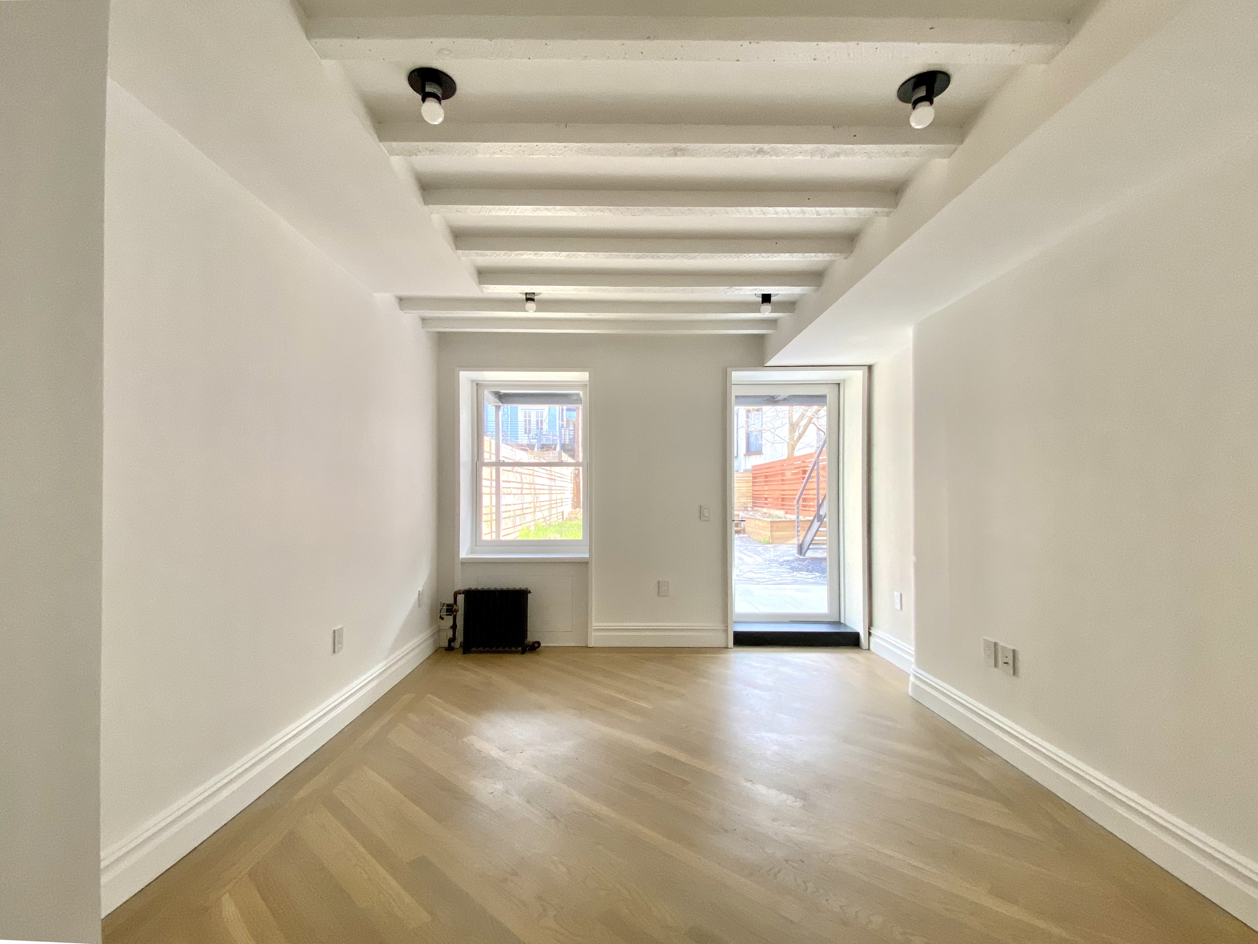 1420 Pacific Street, Unit 1 Brooklyn, NY 11216 - Photo 20 of 30 a view of an empty room with a window