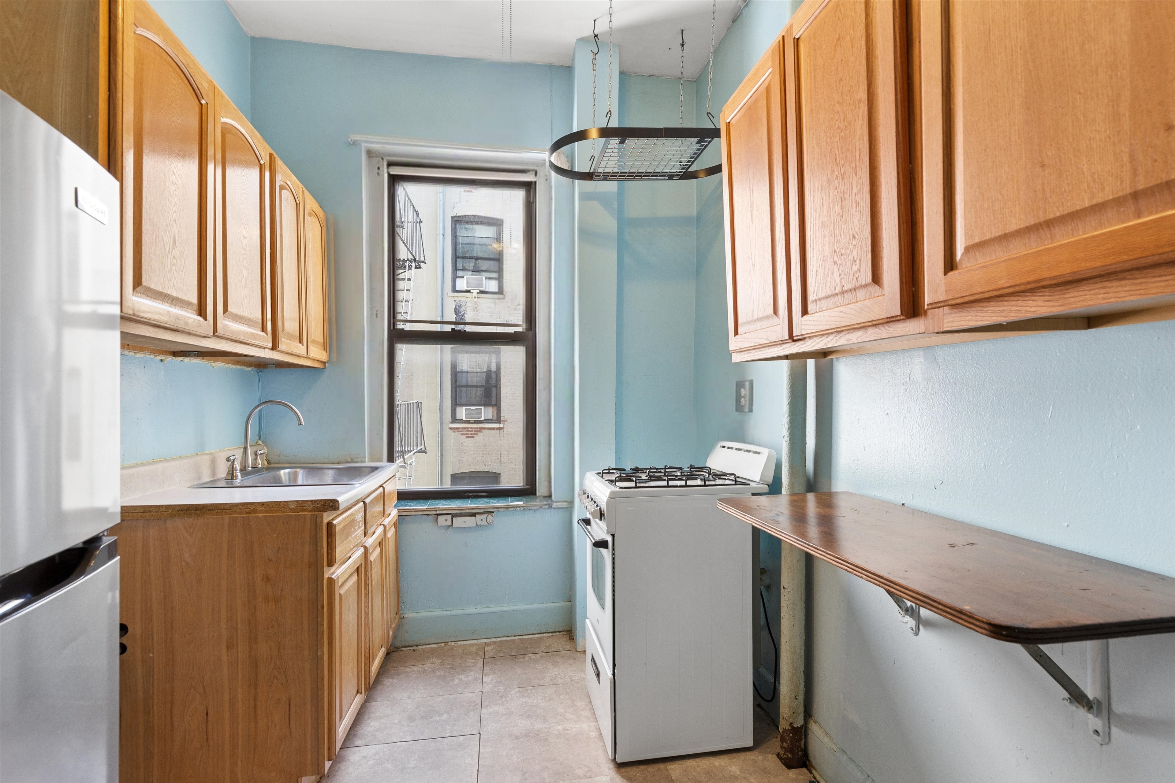15 Fort Washington Avenue, Unit 4E Manhattan, NY 10032 - Photo 4 of 8 a room with storage and utility
