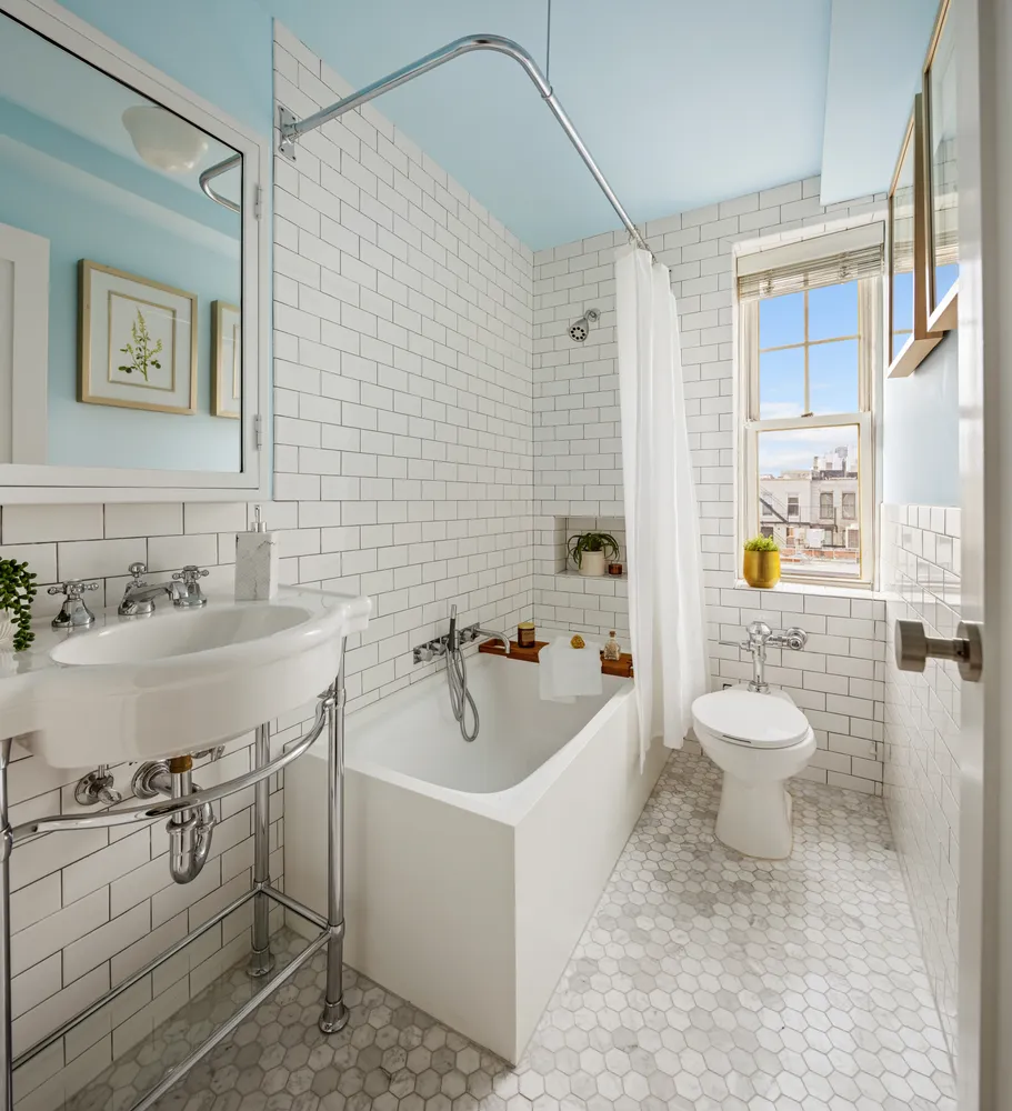 a bathroom with a sink a toilet and a bathtub