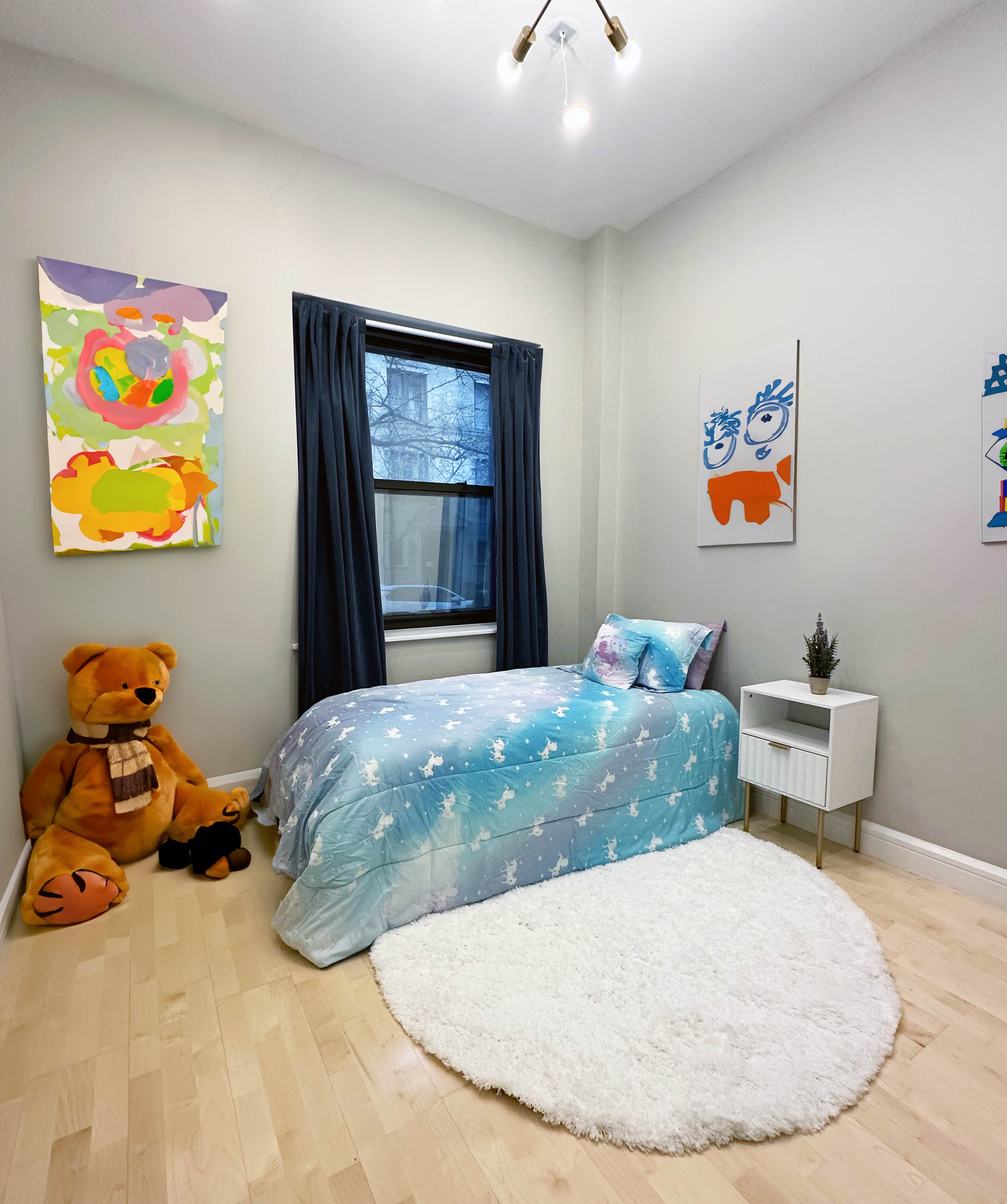 330 East 94th Street, Unit 1AB Manhattan, NY 10128 - Photo 7 of 14 a bedroom with a bed and a painting on the wall