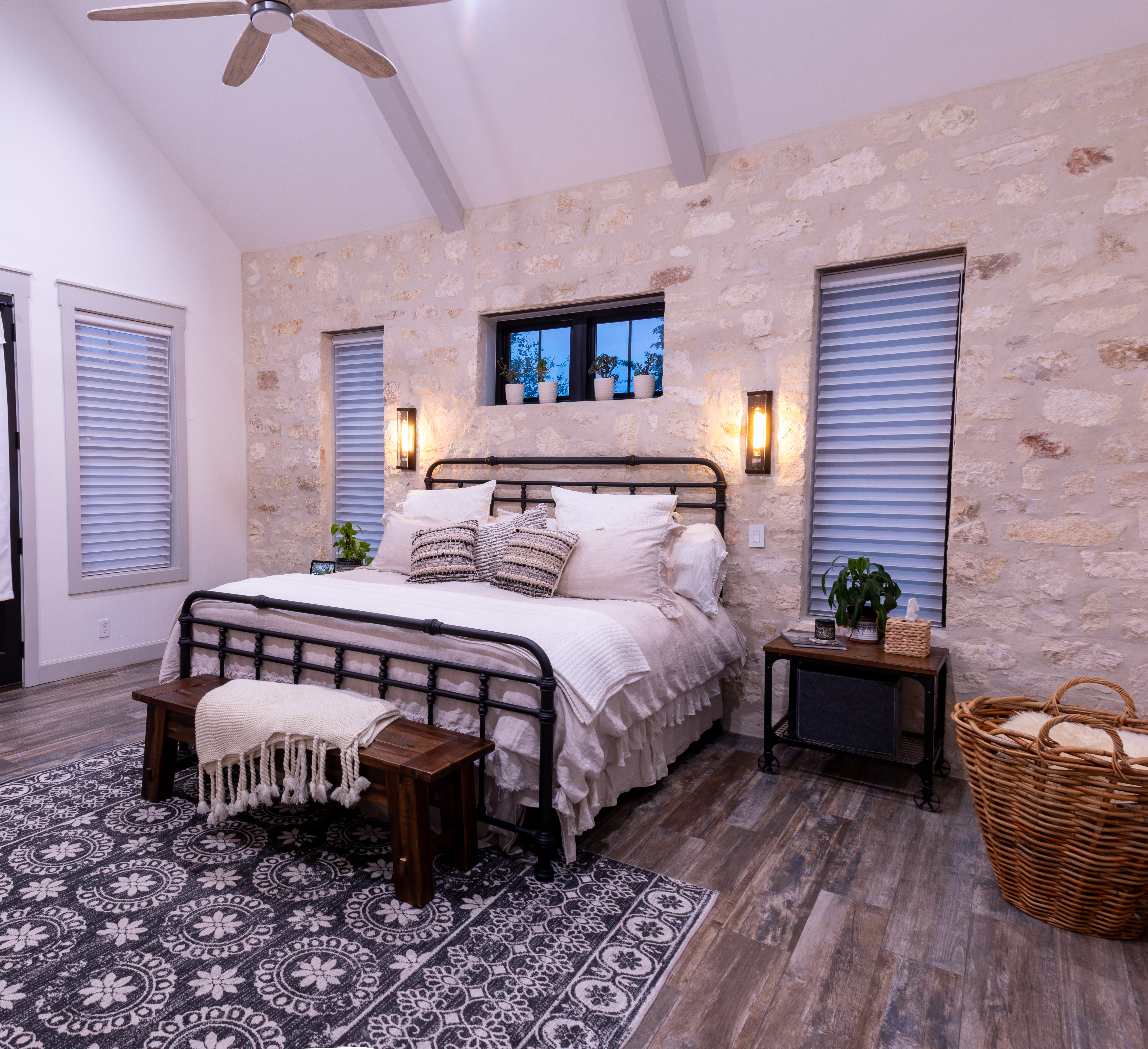 272 Slate Rock Road Willow City, TX 78675 - Photo 7 of 30 a bedroom with a bed and a chandelier