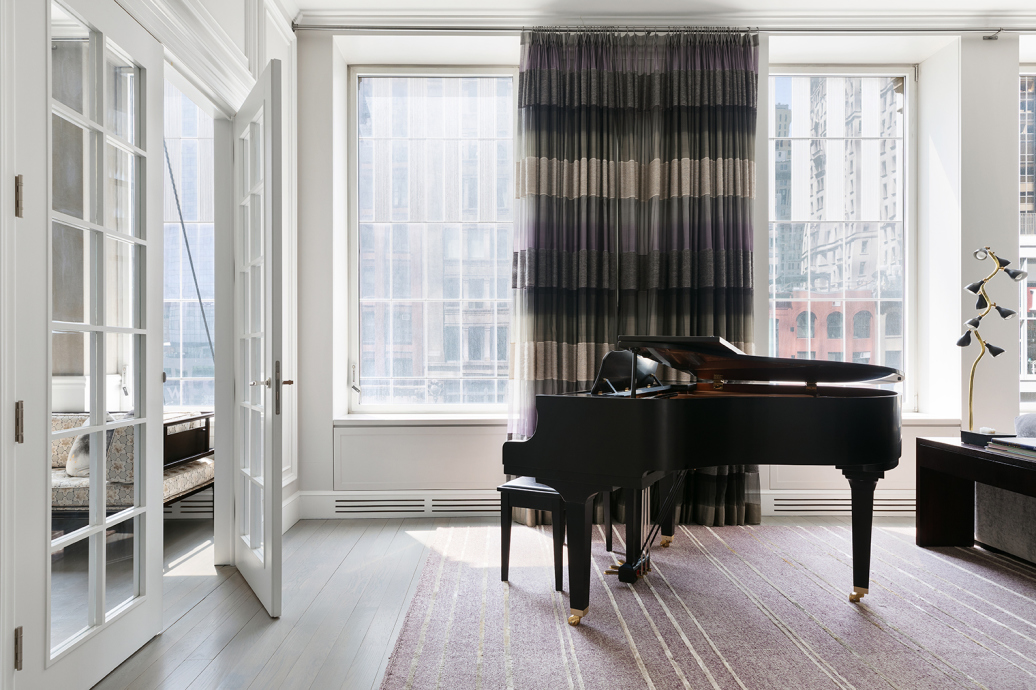114 Liberty Street, Unit 4 Manhattan, NY 10006 - Photo 7 of 13 a living room with furniture and a large window