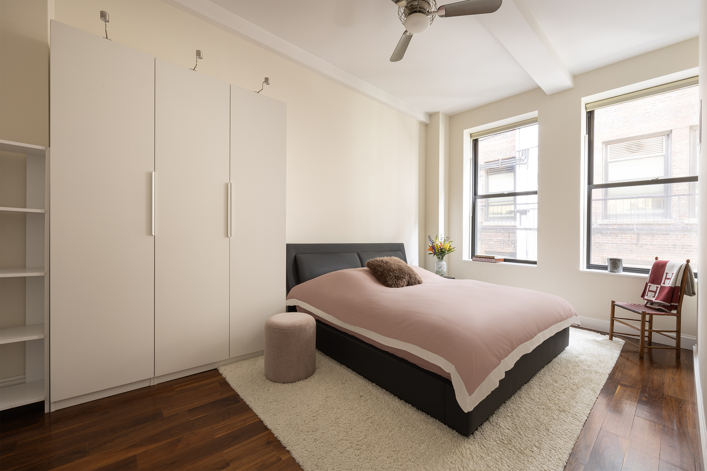 140 West 22nd Street, Unit 5D Manhattan, NY 10011 - Photo 4 of 10 a bedroom with a bed and a window